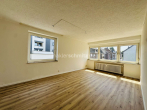 Wohnzimmer 1.OG - 8-PARTEIEN-MEHRFAMILIENHAUS MIT NEUEM VERMIETUNGSPOTENZIAL!